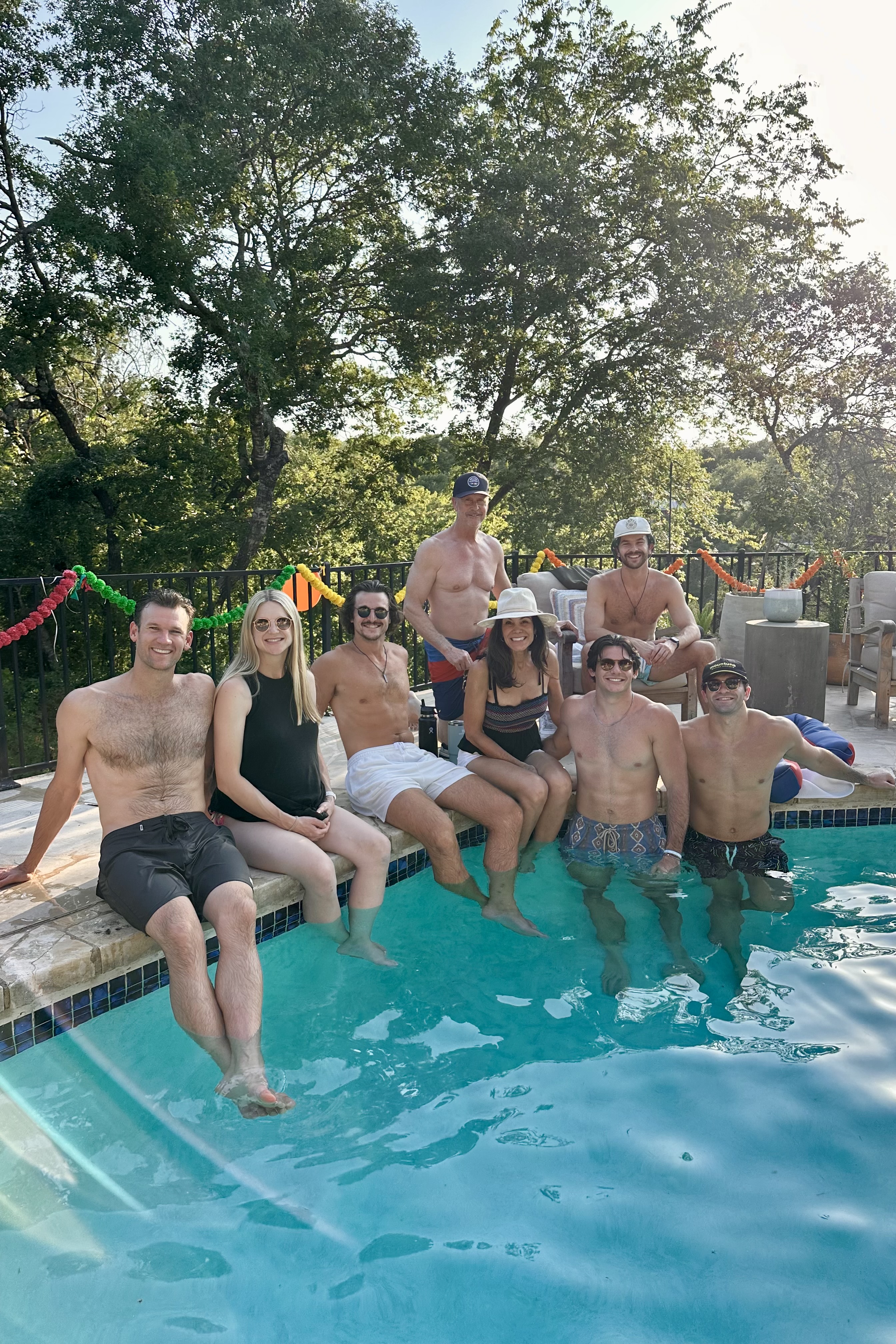 Justin with his family by the pool